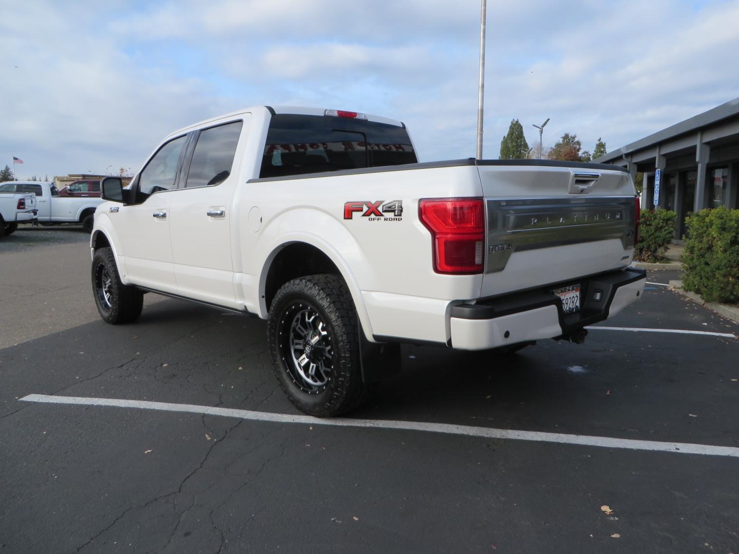 2019 White /BLACK INT W/DARK MARSALA LT Ford F-150 Platinum SuperCrew Cab 4WD (1FTEW1E45KF) with an 3.5L V6 ECOBOOST engine, 10-SPEED AUTO W/TOW MO transmission, located at 2630 Grass Valley Highway, Auburn, CA, 95603, (530) 508-5100, 38.937893, -121.095482 - F150 Platinum featuring a level kit, Fuel Offroad wheels, Toyo AT2 tires, Barricade Front winch bumper, Smittybilt winch, LED light bar, Undercover Ultraflex bedcover, and a Cargo Glide bed system. - Photo#6